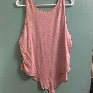Pale pink body suit